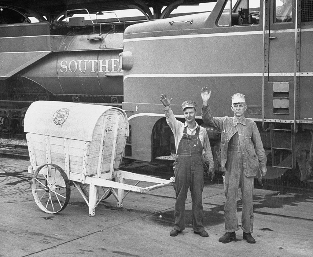 Railroad workers waving to presidential candidate Dwight D. Eisenhower.