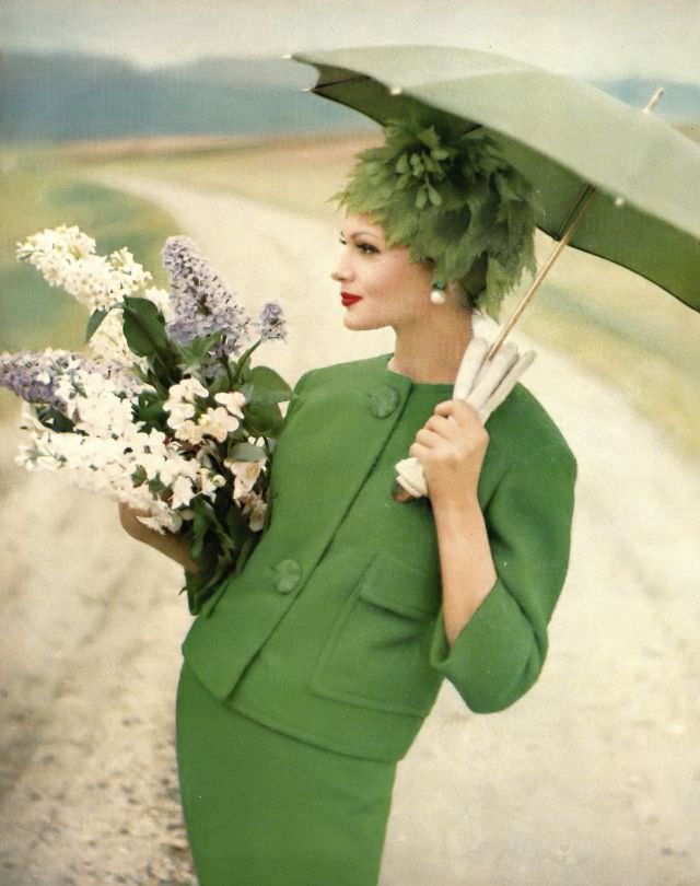 Isabella Albonico in beautiful grass-green tweed suit by Seymour Fox, green leaves hat by Emme. Harper's Bazaar, February 1960
