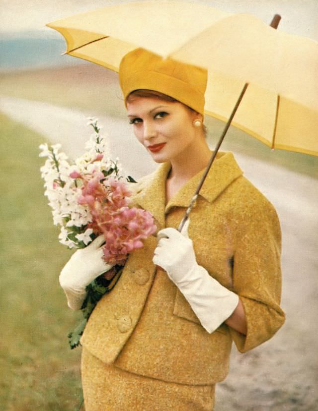 Isabella Albonico in lemon gold wool tweed suit by George Carmel, hat by Emme, Marvella earrings. Harper's Bazaar, February 1960