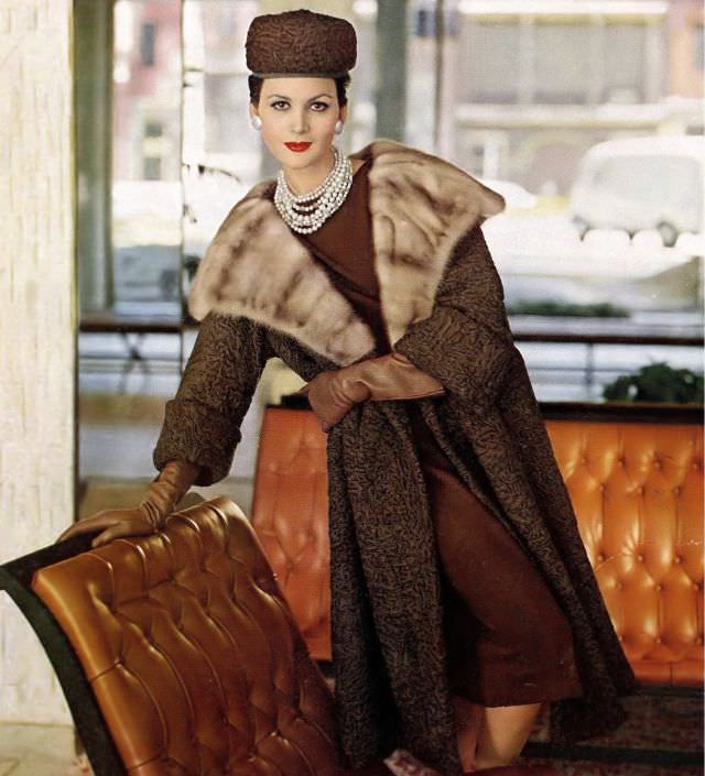 Isabella Albonico in Southwest African Persian lamb coat with mink collar by Evans, hat by Amrose. Harper's Bazaar, November 1960