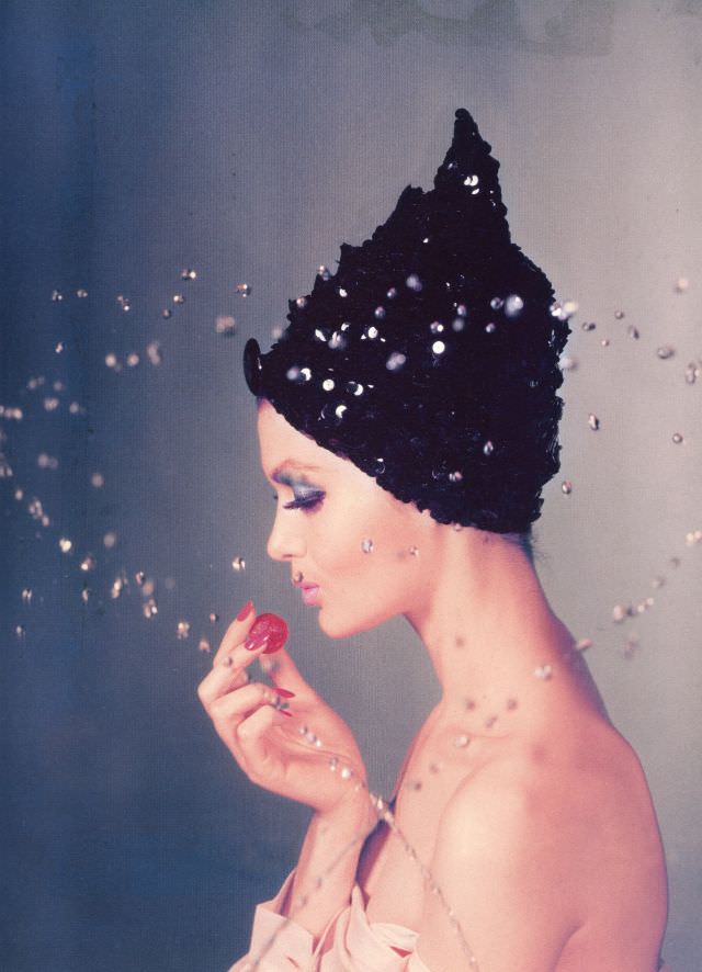 Isabella Albonico wears a black sequined cap by Adolfo for Emme. Vogue, October 1, 1960