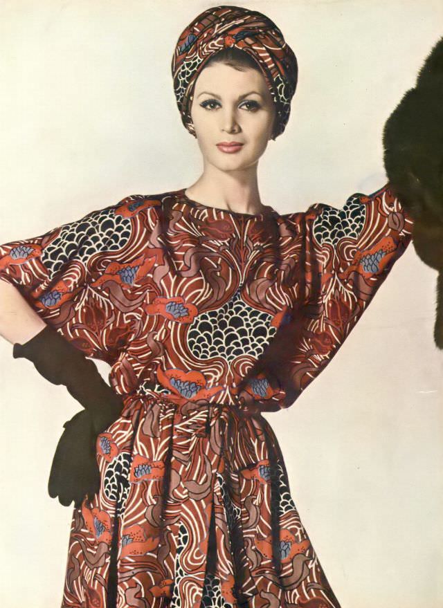 Isabella in silk dress printed in swirls of pale brown and wine with lotus tendrils. Vogue, June 1, 1960