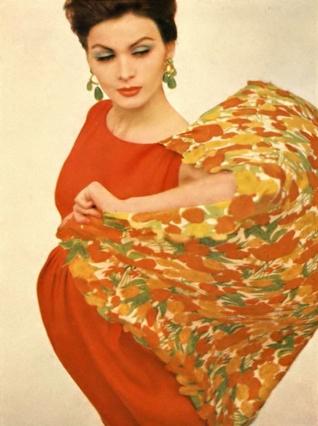 Isabella Albonico in orange Moygashel linen dress worn with orange and limes appliquéd silk half-moon shawl. Harper's Bazaar, April 1962