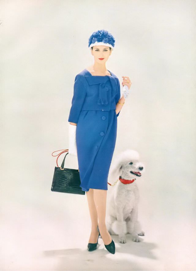 Isabella Albonico in bright hyacinth wool town suit, a cropped top ties across the shoulders, and an eased skirt on a camisole. Vogue, February 1, 1959
