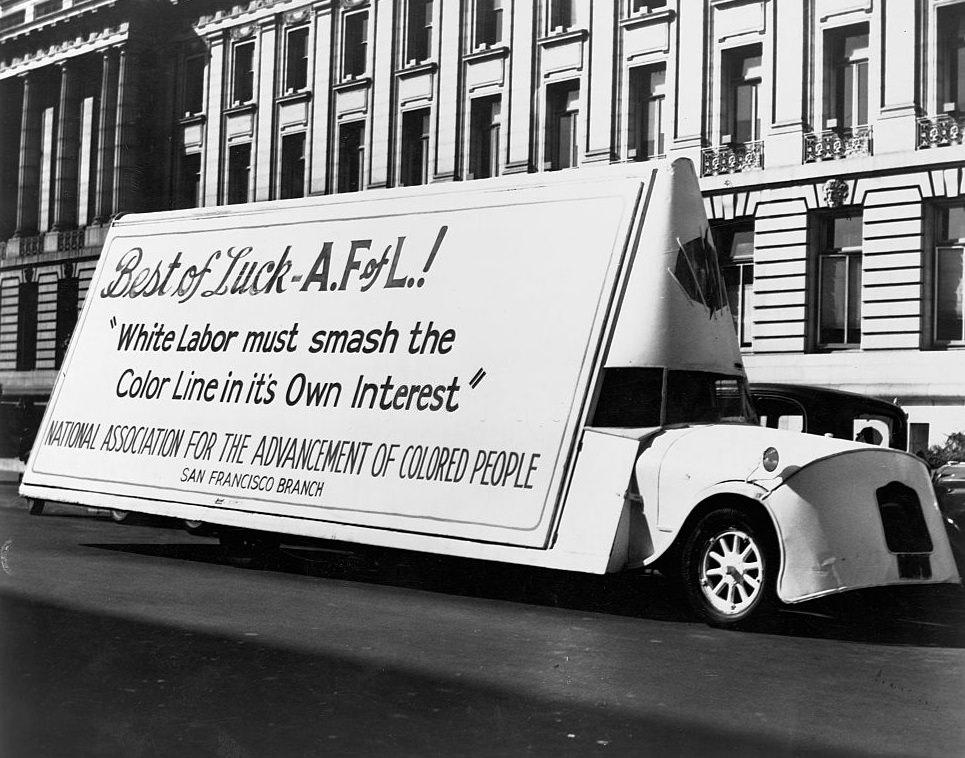 A moving billboard in a parade in Detroit, sponsored by the NAACP, congratulates the American Federation of Labor's stand against race discrimination, 1944.