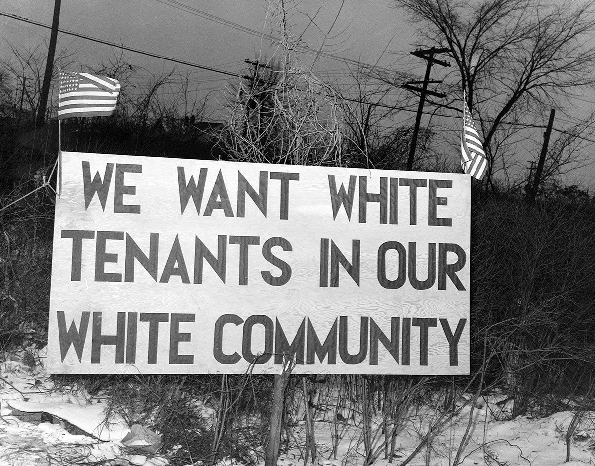 White tenants seeking to prevent black Americans from moving into the Sojourner Truth Homes, a federal governmental housing project, erected this sign in Detroit in 1942.