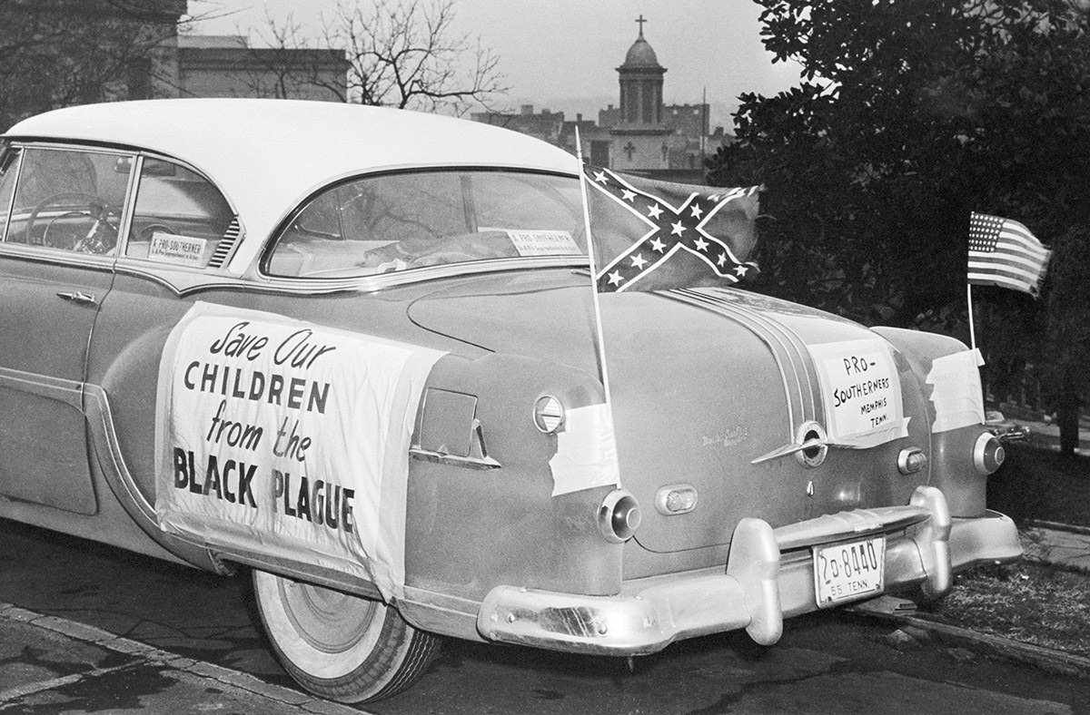 US and Confederate flags fly from a car parked on Tennessee's Capitol Hill in Nashville, where Gov. Frank Clement met with a delegation of pro-segregationists on Jan. 24, 1956.