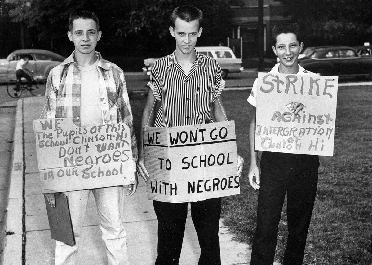 From left: Buddy Trammell, Max Stiles, and Tommy Sanders, students at Clinton High School in Clinton, Tennessee, picket their school when it becomes the first state-supported school to integrate, on Aug. 27, 1956.