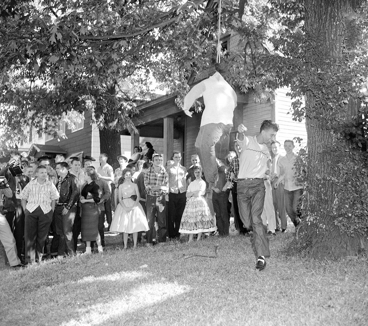 A white student slugs an effigy of a hanging black student outside Central High School in Little Rock, Arkansas, on Oct. 3, 1957, as nearly 75 students of the school walked out to protest integration.