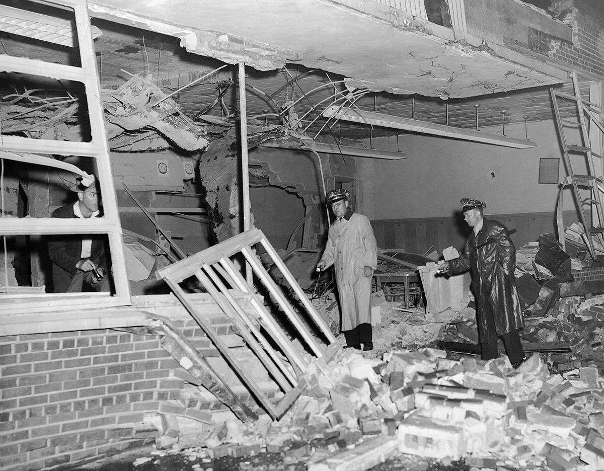 Police examine the wreckage of the newly desegregated Hattie Cotton grammar school, which was dynamited in Nashville, Tennessee, on Sept. 10, 1957.