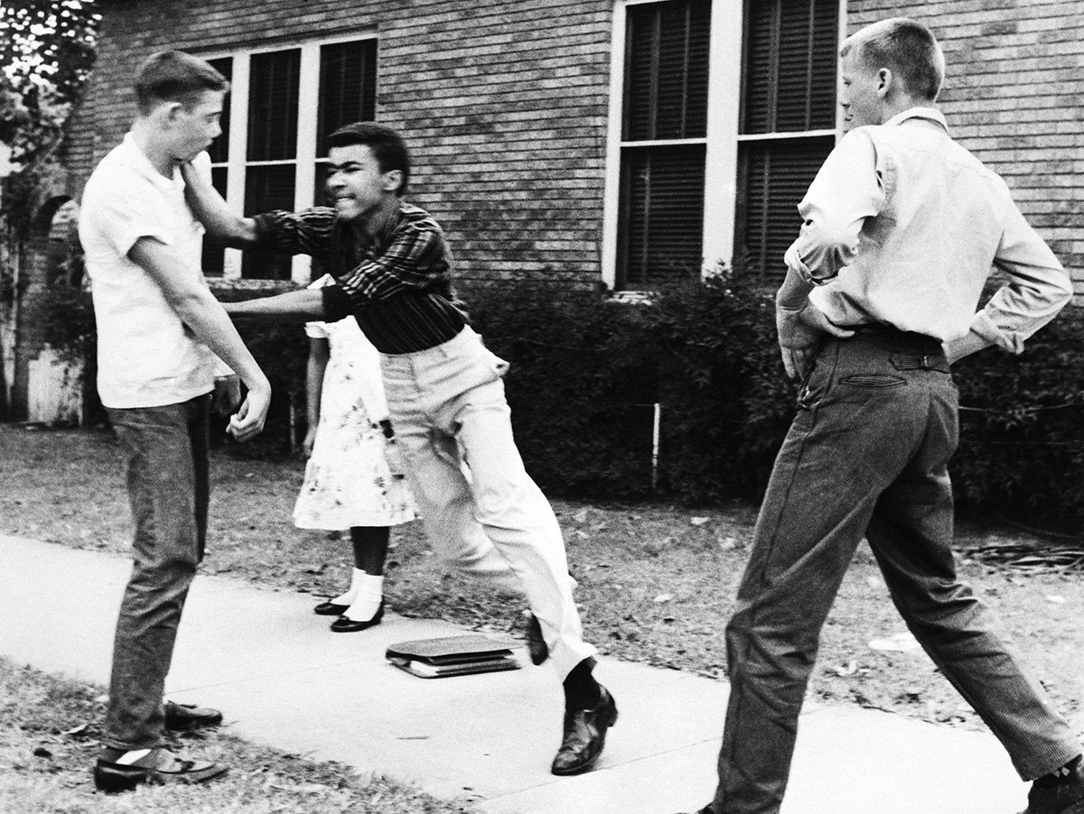 Johnny Gray, 15, punches a white student during a scuffle in Little Rock, Arkansas, on June 16, 1958.