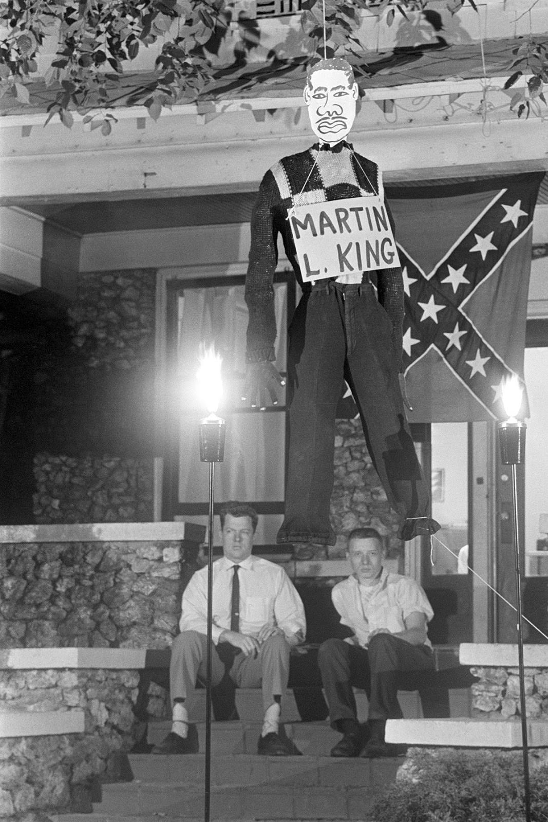 Edward R. Fields and James Murray, hang an effigy of Martin Luther King Jr. outside the party's headquarters in Birmingham, Alabama, on May 6, 1963.