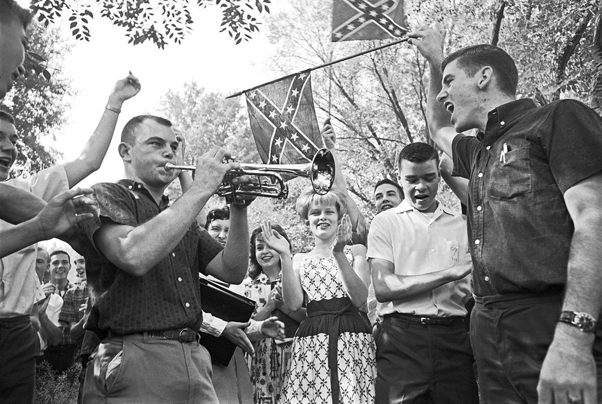 Demonstrators outside of West End High School in Birmingham, Alabama, sing songs and cheer during an anti-desegregation protest on Sept. 10, 1963.