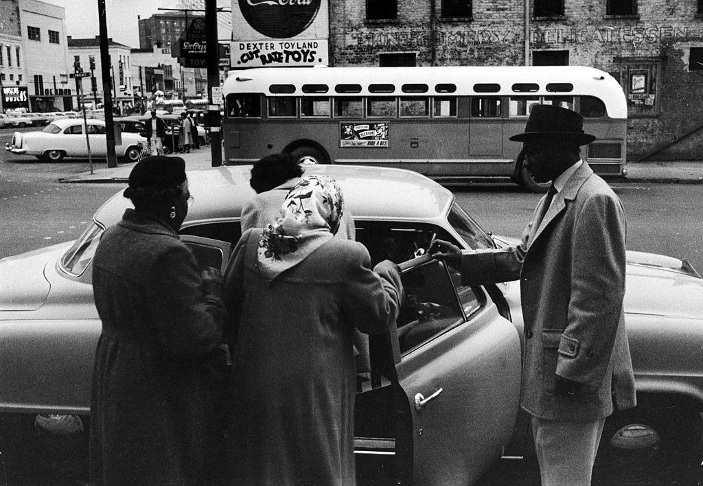 A group of African Americans get into an automoboile to car pool during the Montgomery bus boycott, Montgomery, Alabama, February 1956.