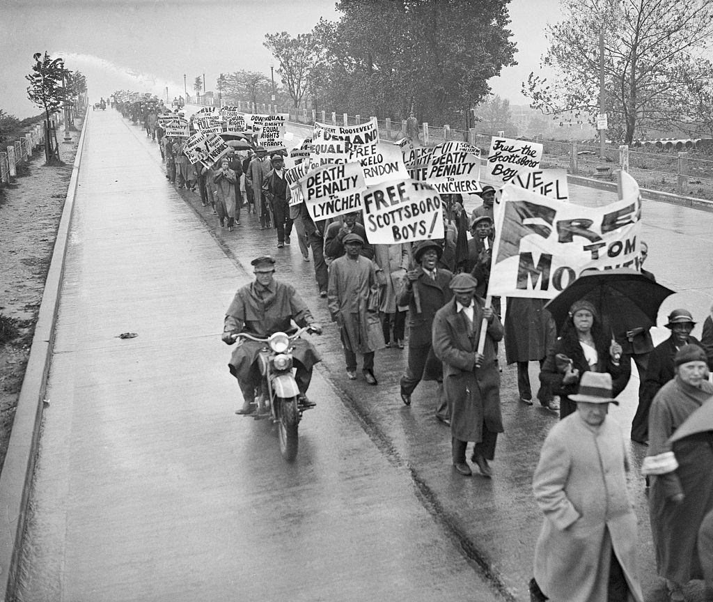 Hundreds of demonstrators march in Washington D.C. against the trials in the Scottsboro case.