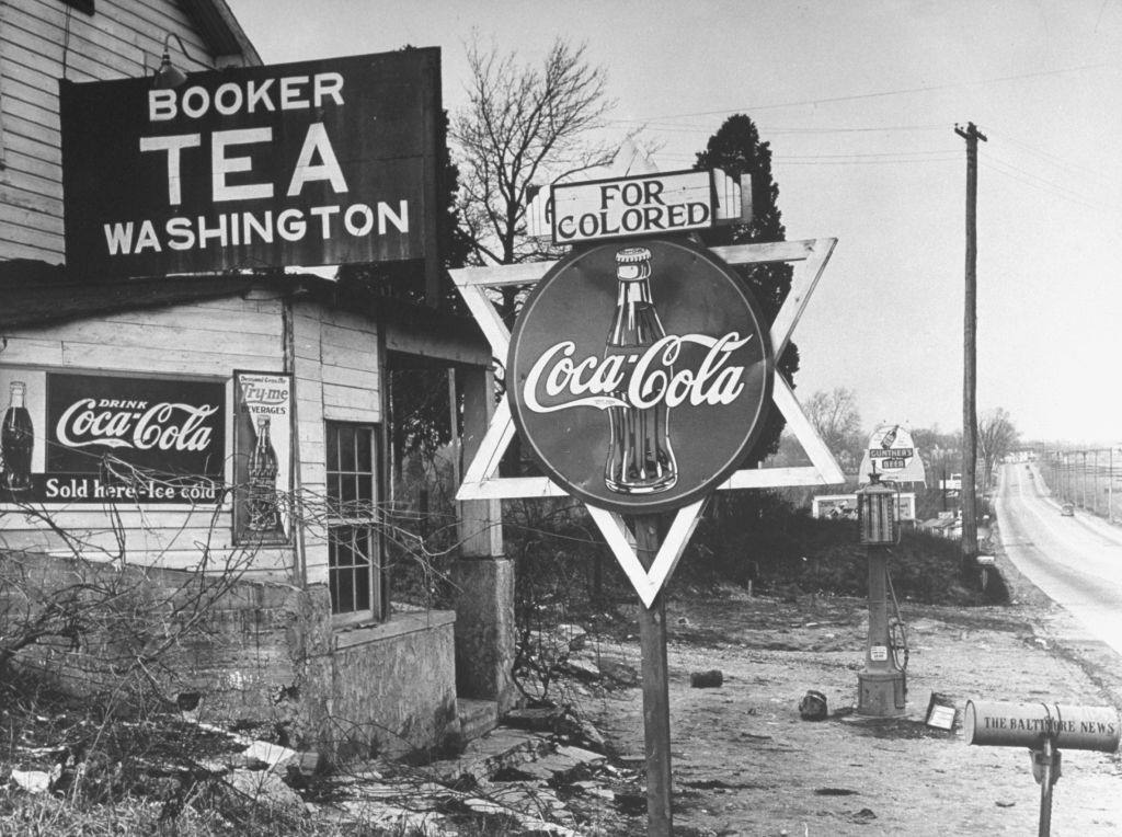 For Colored, sign atop round Coca-Cola sign tacked to a wooden Star of David in Washington, 1938.