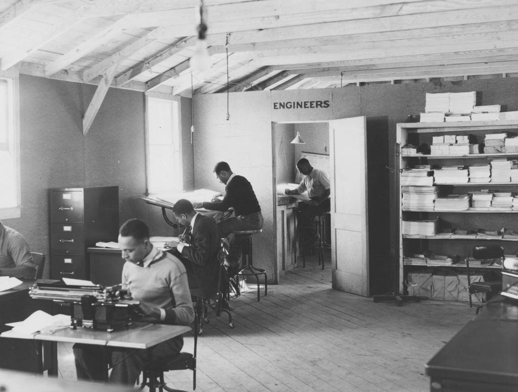 Black and white photograph of male, African-American engineers, working in an apparently segregated office, located in Newport News, Virginia, 1936.