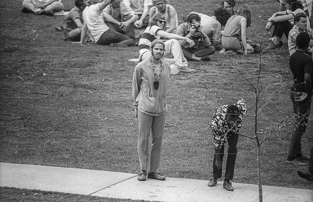 Kent State University student Brother Fargo stands on a sidewalk during student demonstrations on the university campus, May 3, 1970.