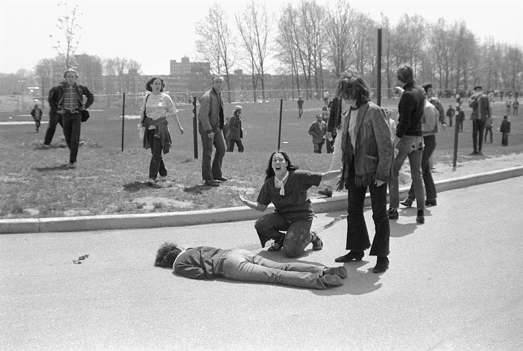 Teenager Mary Ann Vecchio screams as she kneels over the body of Kent State University student Jeffrey Miller who had been shot. May 4, 1970.