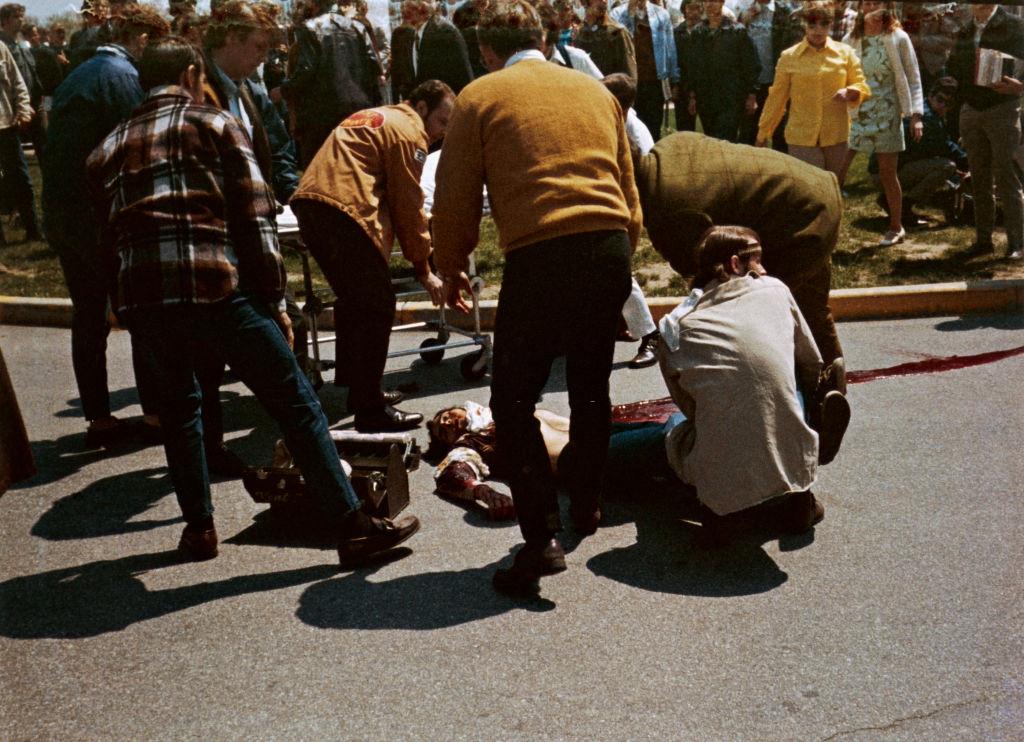 People carrying a dead body of protestor who was shot down by the National Guards, May 4th 1970.