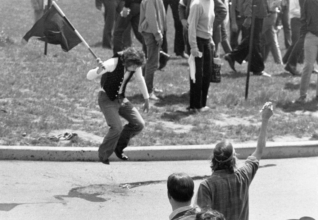 Irate Protester jumps up and down on the spilled blood of one of the students shot down by Ohio National Guardsmen here during the protest, 4 May 1970.