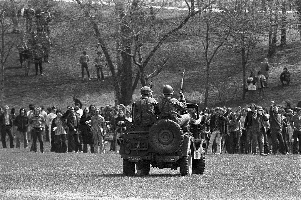Masked National Guardsmen fired a barrage of tear gas into a crowd of demonstrators on the campus of Kent State University May 4th, 1970.