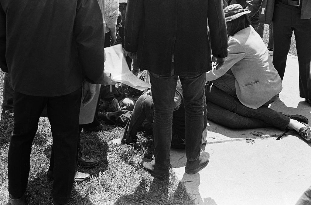 Wounded and dazed, a Kent State University student is comforted by fellow-students after bieng shot by national guardsmen May 4, 1970.