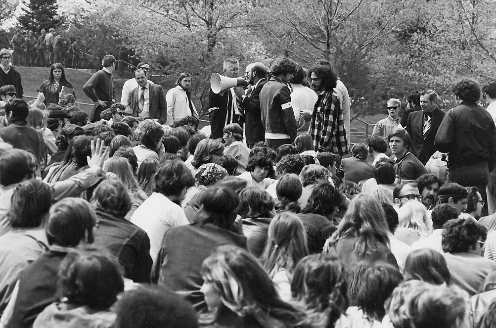 On Blanket Hill, Kent State University faculty use a microphone to try and convince antiwar demonstrators and students to disperse after the Ohio National Guard opened fire on them, Kent, Ohio, May 4, 1970.