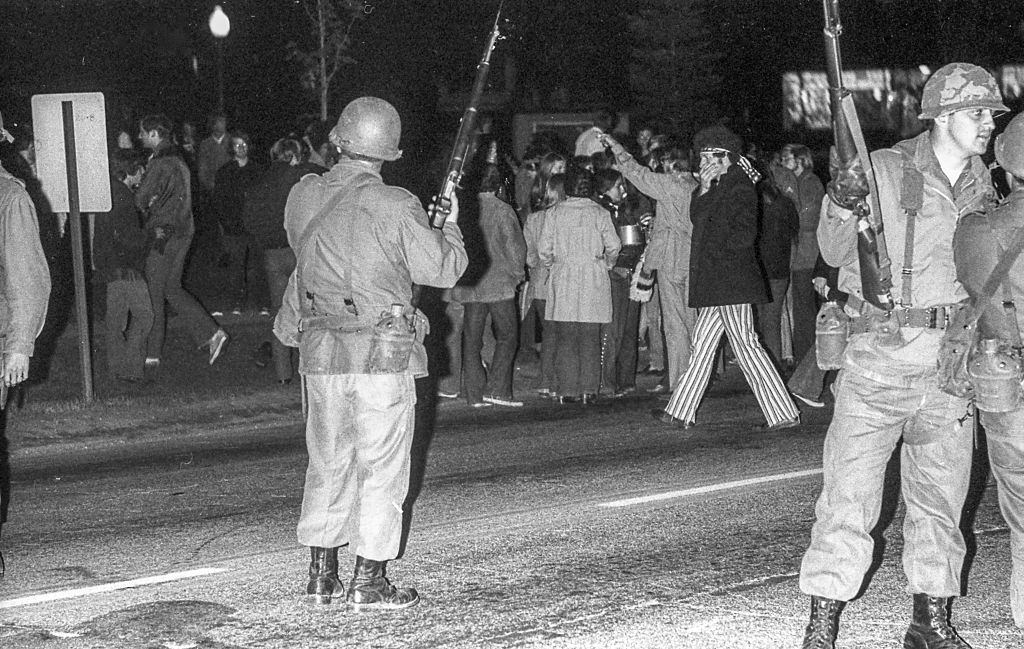 Nighttime view of a line of Ohio National Guardsmen, Kent, Ohio, May 3, 1970.