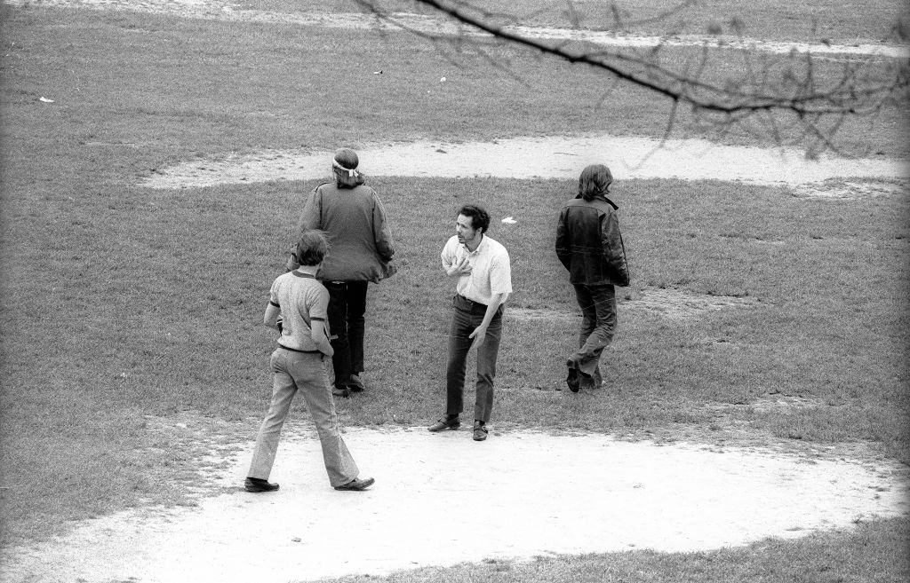 A man tries to students on the Commons, Kent, Ohio, May 4, 1970.