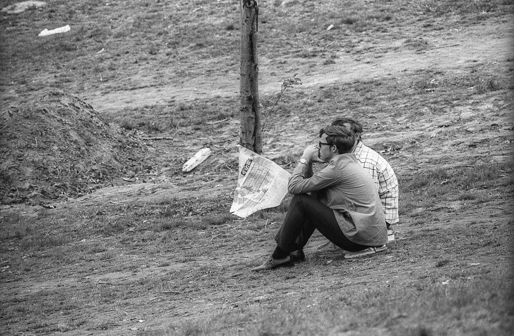 Students sitting on the grass after the shootings, May 4th 1970.