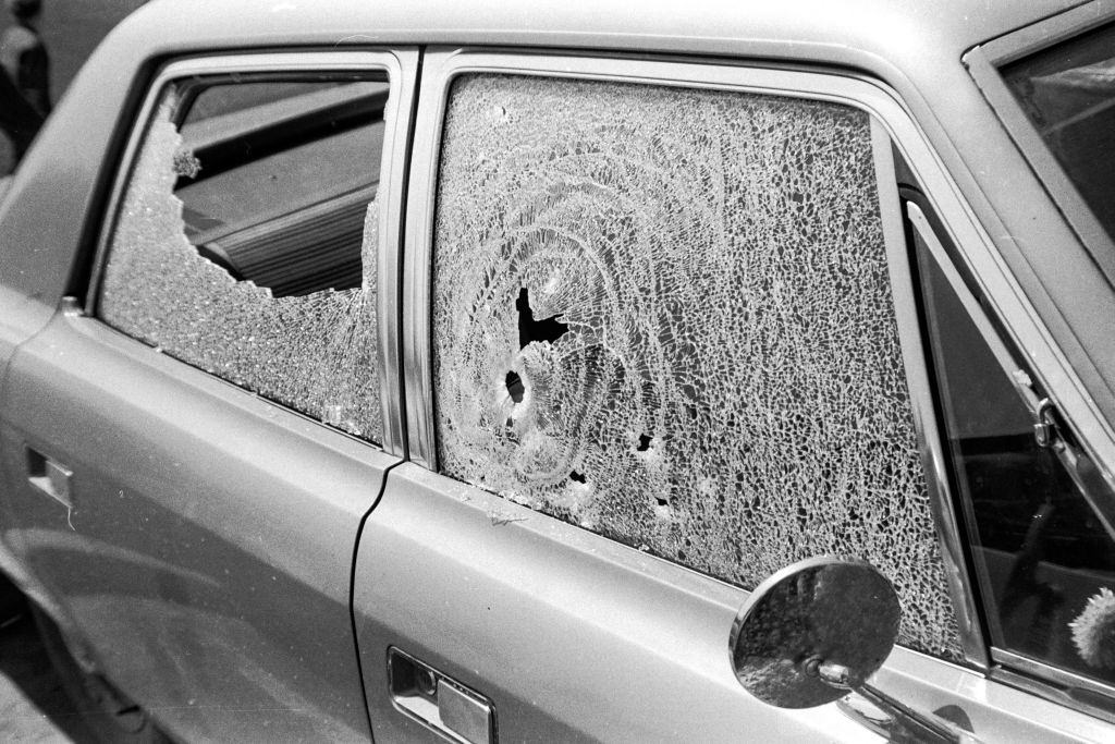 Broken windows of a parked car (in the Prentice Hall parking lot) caused by bullets after the Ohio National Guard opened fire on Students, May 4th 1970.