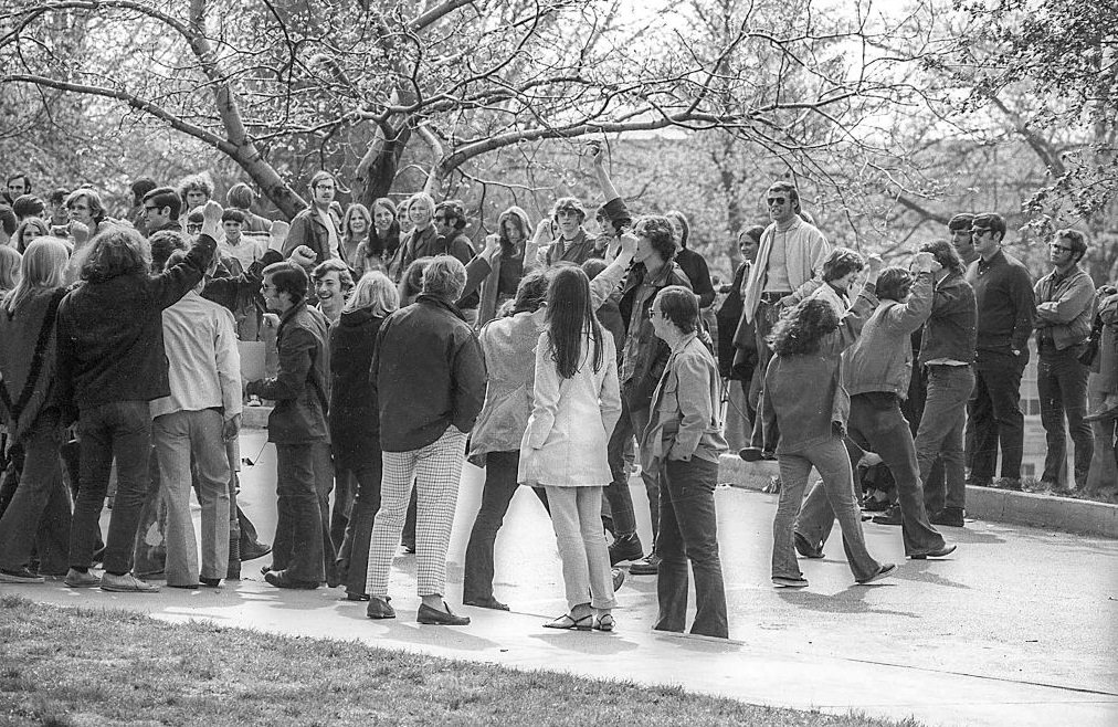 Kent State University students, some with raised fists gather on a campus road in the wake of student antiwar protests, Kent, Ohio, May 3, 1970.