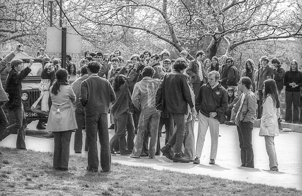 Kent State University students, some with raised fists gather on a campus road in the wake of student antiwar protests, Kent, Ohio, May 3, 1970.