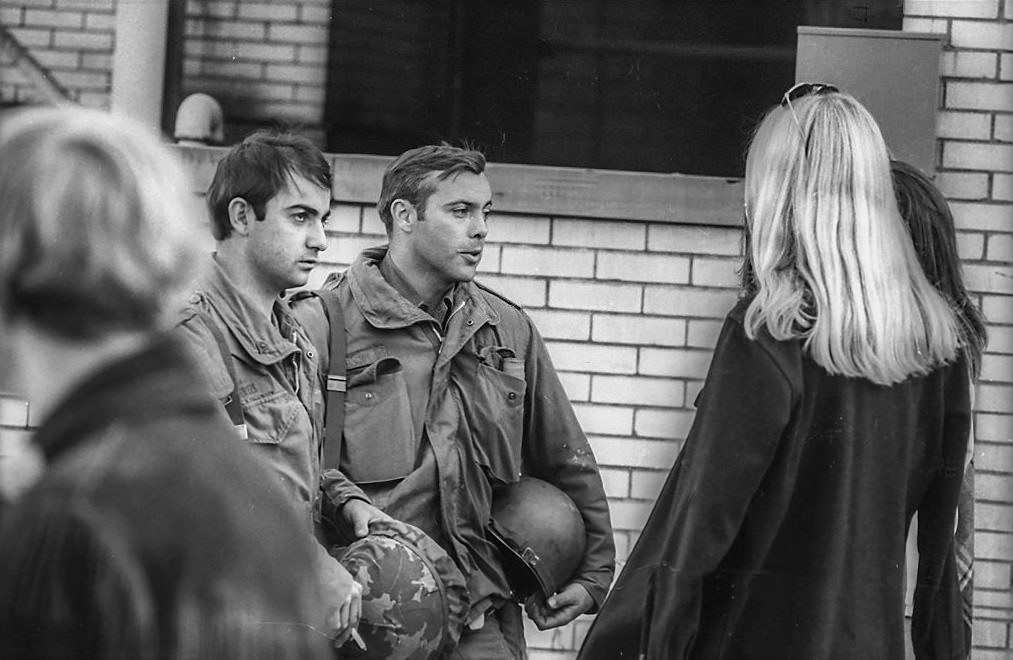 Ohio National Guardsmen as they talk with female Kent State University students on the university's campus in the wake of student antiwar protests, Kent, Ohio, May 3, 1970.