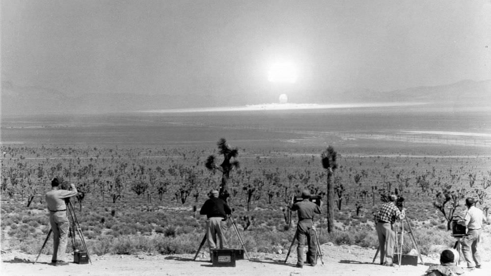 Camera men filming the atomic blast of Wasp Prime Test, during Operation Teapot. Nevada, February 18, 1955.