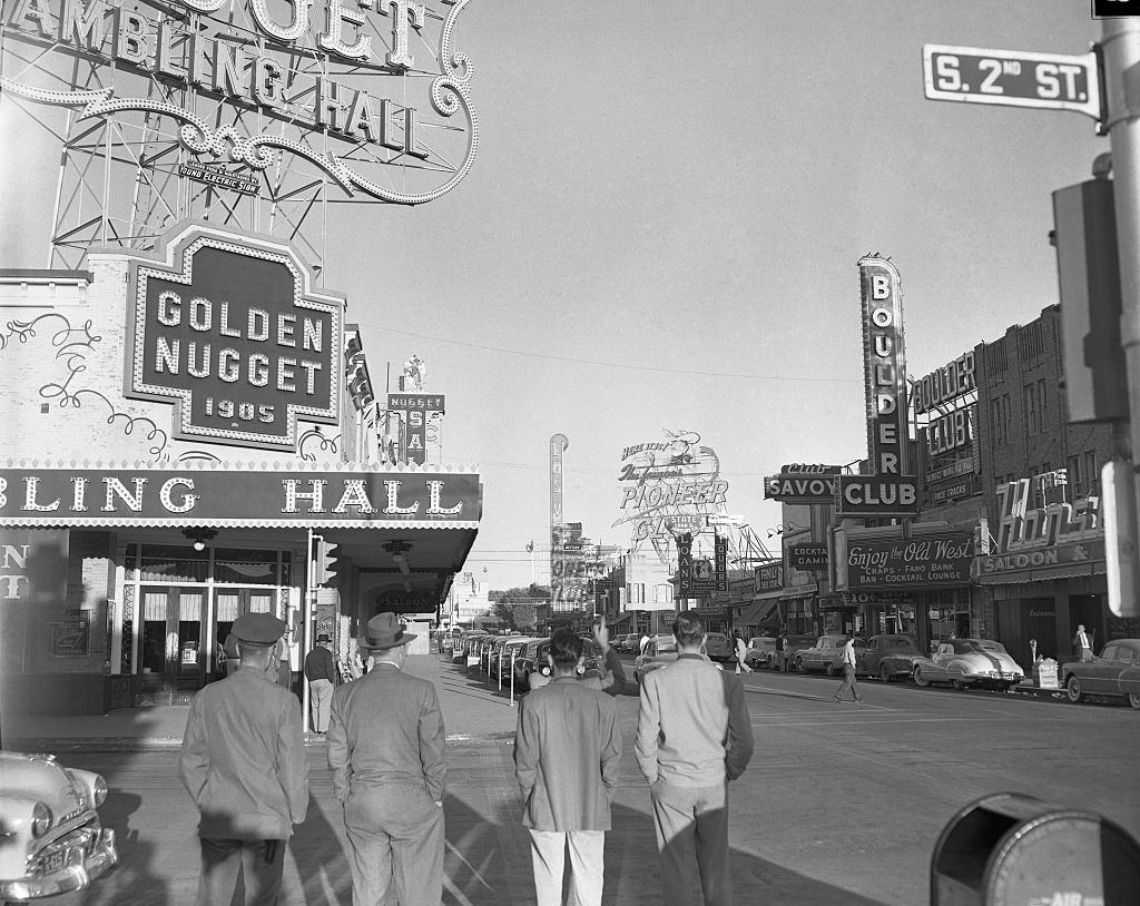 Spectators on Fremont Street in Las Vegas look in vain for the atomic explosion, 1951.