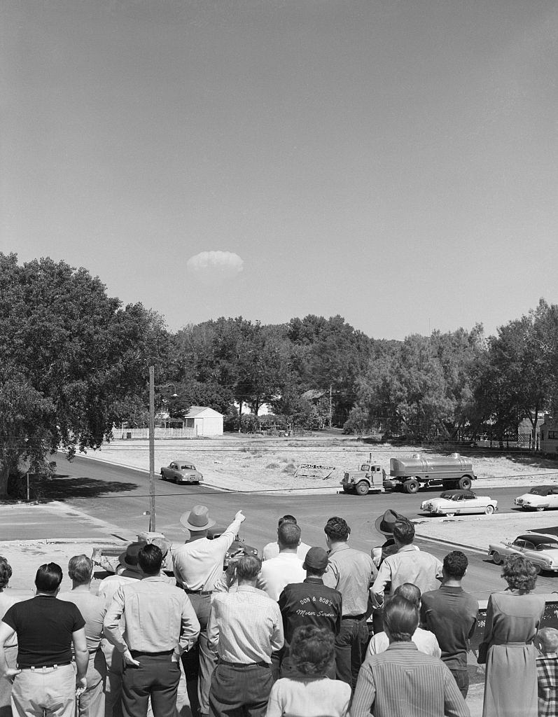 Residents of Las Vegas watch the mushroom cloud of a distant test of an atomic bomb, 1952.