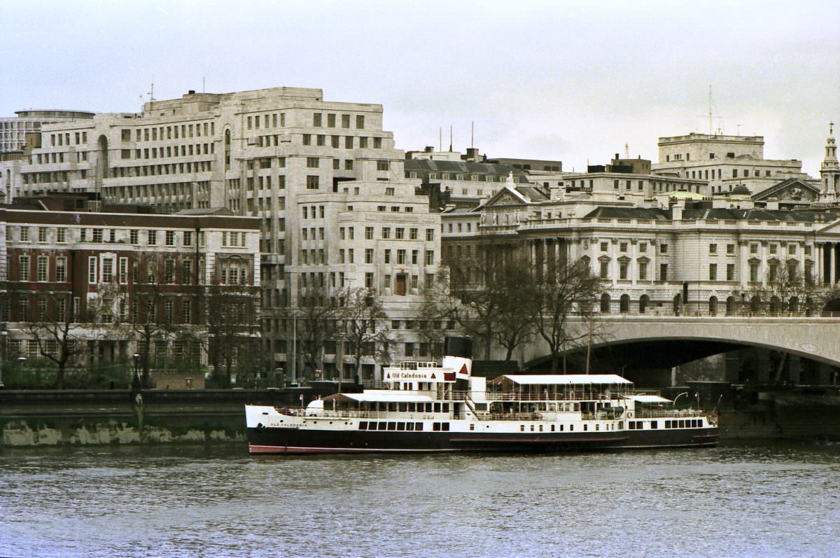 Paddle steamer, ‘Old Caledonia’ moored by the Thames Embankment adjacent to Waterloo bridge. 19th April 1975