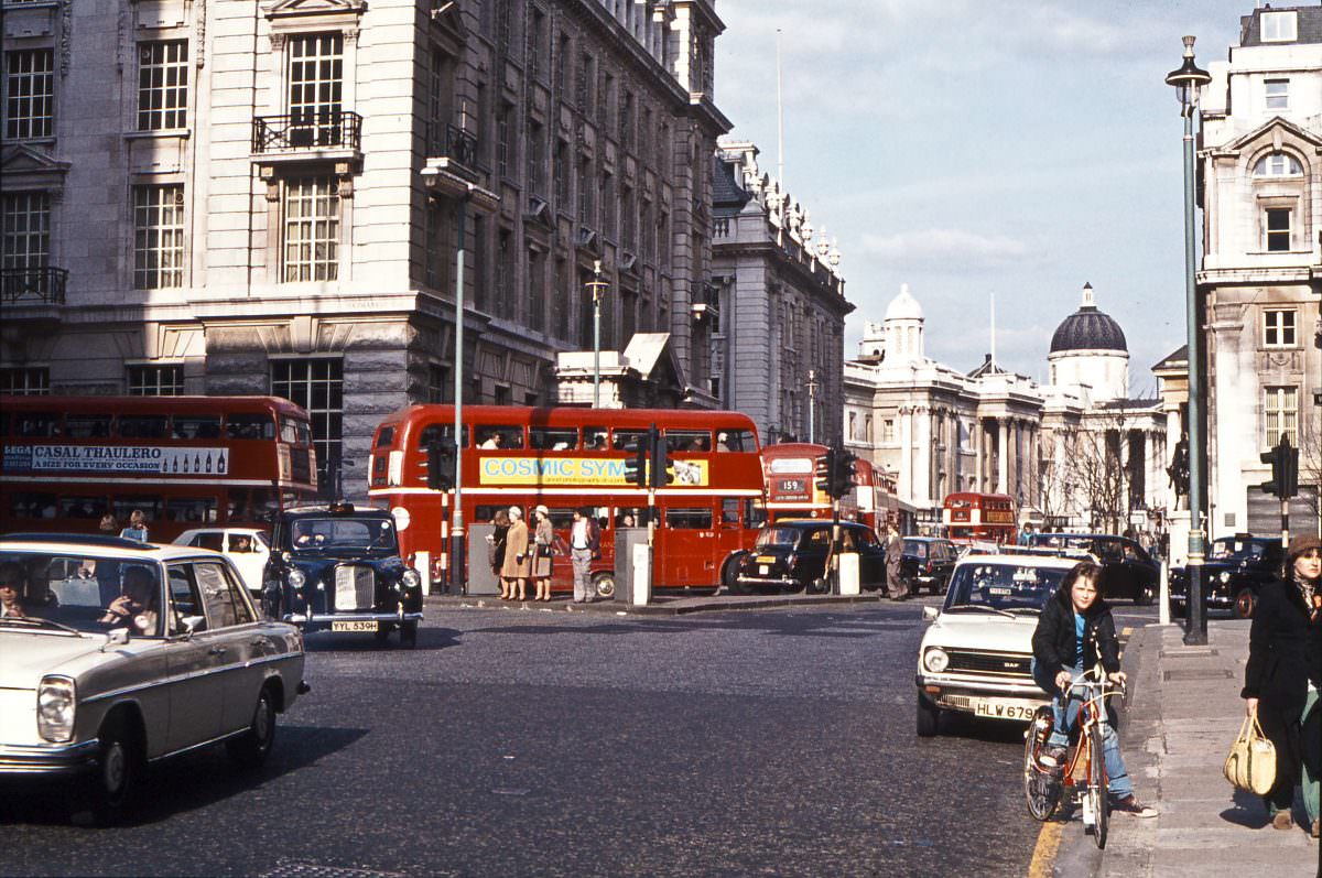 Routemasters turning from Haymarket into Pall Mall, April 1976