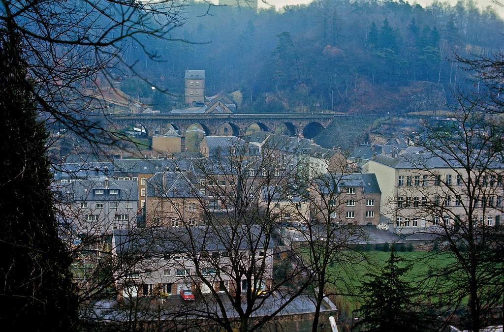The "Hiel"-valley in the lower district of Luxembourg-Pfaffenthal showing the Hiel-gate, the railway bridge and the primary school. Luxembourg City, Jan 1972.