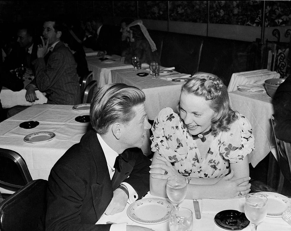 Mickey Rooney has dinner with a friend in Los Angeles, 1937.