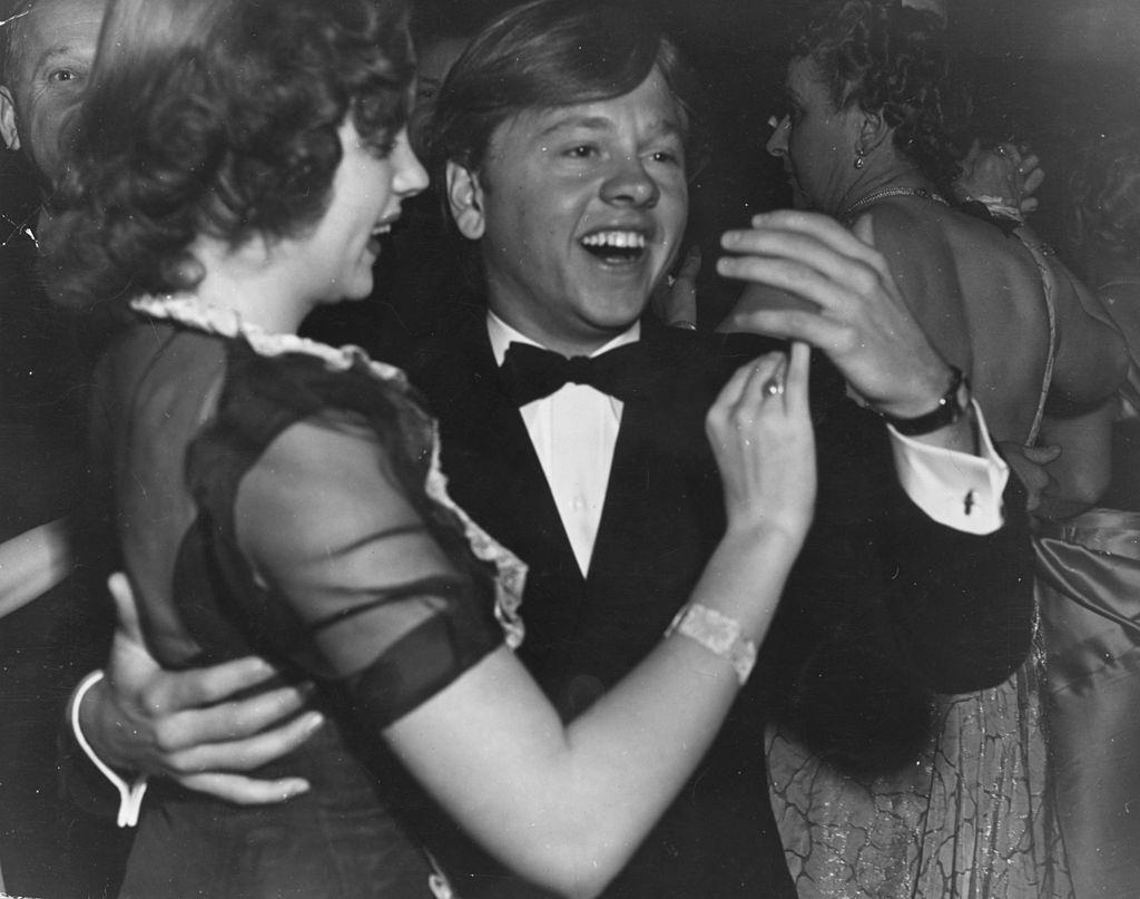 Mickey Rooney dances with Judy Garland.