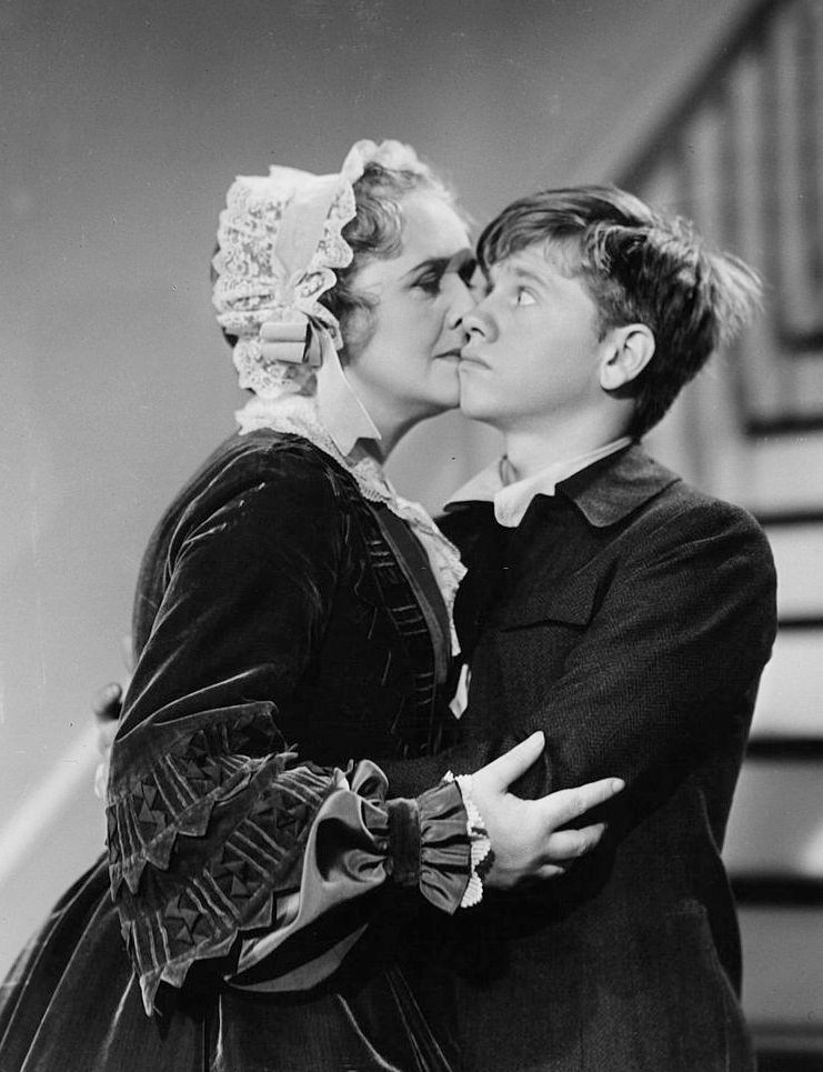 Elizabeth Risdon kisses Mickey Rooney in a scene from the film 'The Adventures Of Huckleberry Finn', 1940.