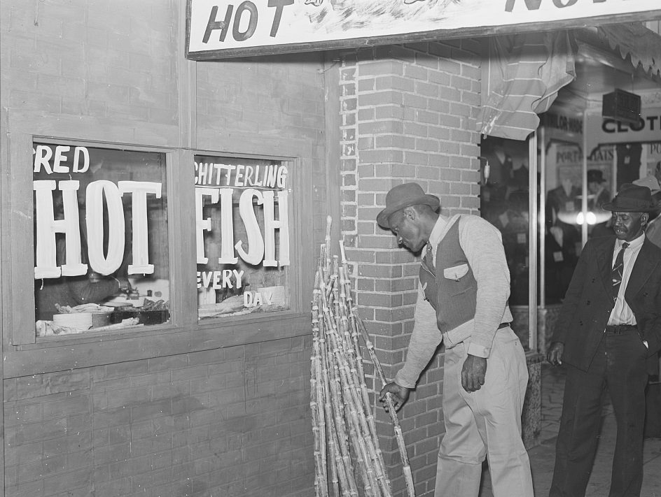 Chitterlings, fish and sugarcane on street in Negro section, Clarksdale, Mississippi Delta. On a Saturday afternoon, November 1939.