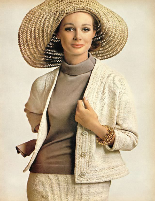Monique Chevalier in bleached-sand textured knit suit with turtle-neck shell, Harper's Bazaar. April 1963