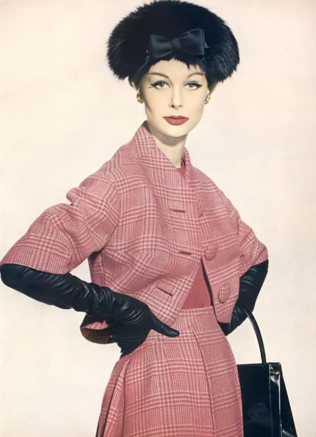 Monique Chevalier in raspberry Glen plaid wool suit, jacket lining and camisole of deep claret crêpe, Vogue. September 15, 1958