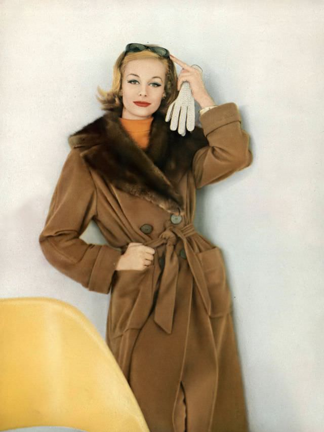 Monique Chevalier in the end-all trenchcoat of vicuña and natural Russian sable, Vogue. September 15, 1958
