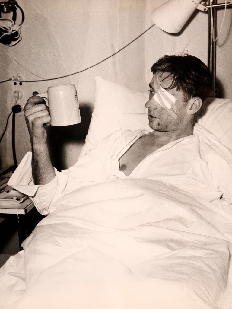 Manchester United survivor Ray Wood holds a tankard of beer following the Munich Air Disaster.