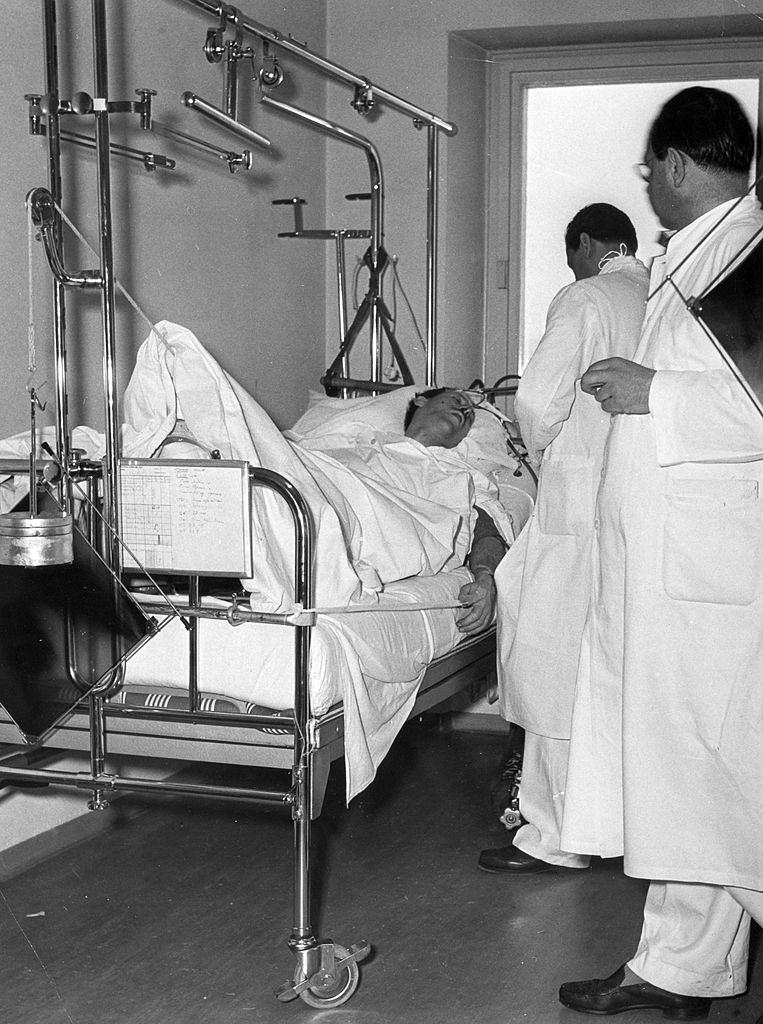 Captain Ken Rayment lies injured in hospital in Munich. 8th February 1958